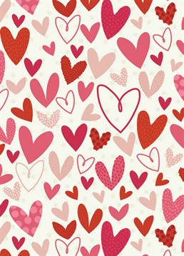 A pretty, seamless pattern design of polka dot hearts for Valentine's 2022.
