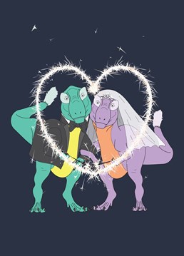 Send your newly-wed loved ones off on their happy ever after with this unique greeting card featuring everybody's favourite prehistoric couple, a T-Rex and his blushing Bride! Celebrate their love with sparklers and a prehistoric smile!