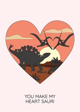 The perfect dinosaur card to show your feelings this Valentine's day. Featuring a large heart with a sunset dinosaur scene inside it. The scene features two pterosaurs making a heart with their wings and beaks and a stegosaurus with heart back plates. Designed by Dinosaurs Doing Stuff