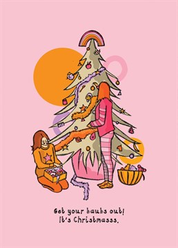 A vibrant pink illustrated Christmas card of two friends putting up their Christmas tree with the caption 'Get your baubs out! It's Christmasss.' The perfect Christmas card for your friend or girlfriend this Christmas.