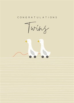 Baby card from Laura Darrington Design featuring two pull along ducks, above the caption reads "Congratulations, Twins".