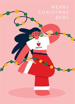 Merry Christmas Babe! This card features a woman dancing around the christmas lights with her I Love Santa t-shirt on and funky bauble earrings. It's the perfect Christmas card to send to your best mate this festive season!
