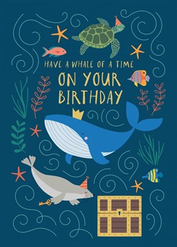 A sweet, illustrated children's birthday card featuring a busy underwater scene and the caption "Have a Whale of a Time on Your Birthday". A majestic blue whale wearing a crown is surrounded by sea creature friends including a turtle, fish and a sea lion in a party hat. The perfect gender-neutral all ages kids birthday card for the animal lover.