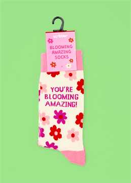 These You Are Blooming Amazing Socks are the perfect way to show someone you care and think they are amazing. With a playful pun and in unisex size 6-11, these socks are a unique and fun gift for any occasion. Spread positivity and put a smile on someone's face with these lovely socks.