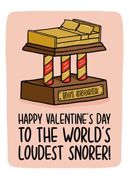 This funny snoring Valentines card features a bed shaped trophy with the phrase "Happy Valentine's Day to the world's loudest snorer!"