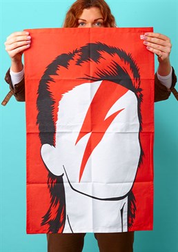 Oh, you pretty thing&hellip;. Celebrate the life of a musical legend. Dry the dishes in style. Illustrated silhouette design. Iconic Ziggy Stardust lightning-bolt look. It's all hunky dory if you're a Ziggy Stardust fan as the iconic David Bowie is emblazoned in stunning fashion on this tea towel. Inject a splash of colour and style into the most mundane of tasks, with this striking black and white Bowie silhouette on a red background. Whack on some of his greatest hits and you won't even mind that you're still standing at the sink half an hour later. You too can be a dish-washing hero just for one day! This is a must-have, and very practical gift for any Bowie lover that'd look amazing displayed in the home.