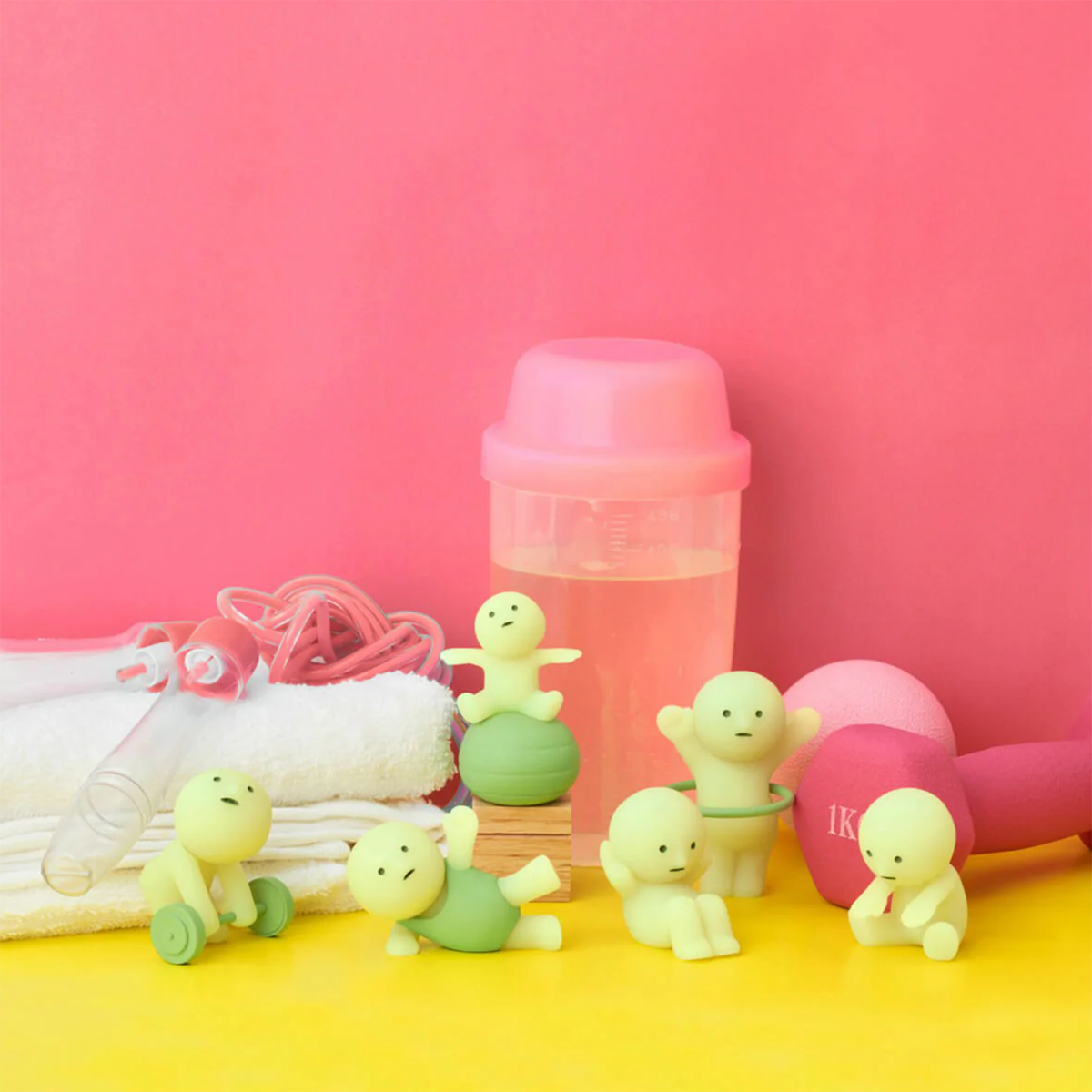 Smiski Exercise Series figures in workout poses beside exercise equipment